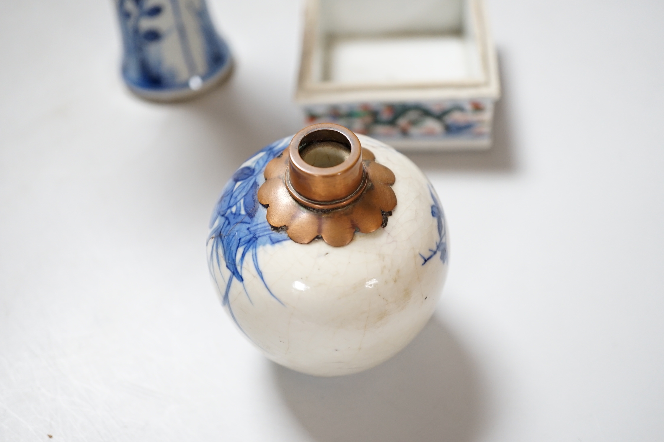 Three Chinese blue and white vases and a wucai square box, one with inscription, 18th century and later, tallest 14cm high